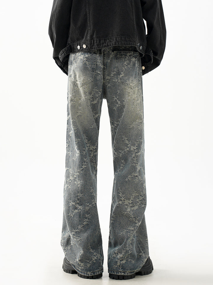 Pantalones de mezclilla acampanados desgastados retro 