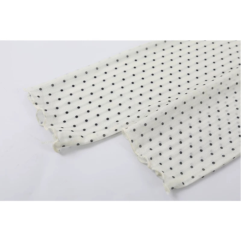 Polka Dot Ruffled Hem Turtleneck Top