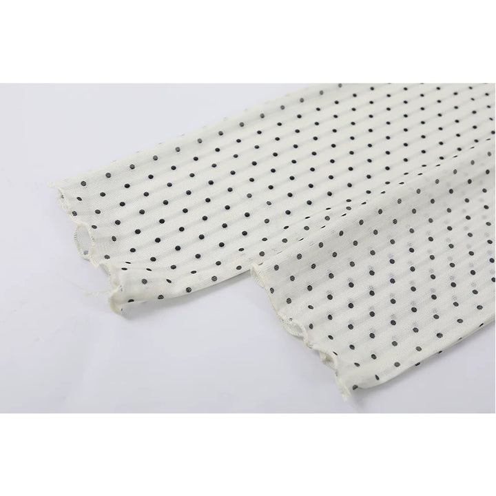 Polka Dot Ruffled Hem Turtleneck Top