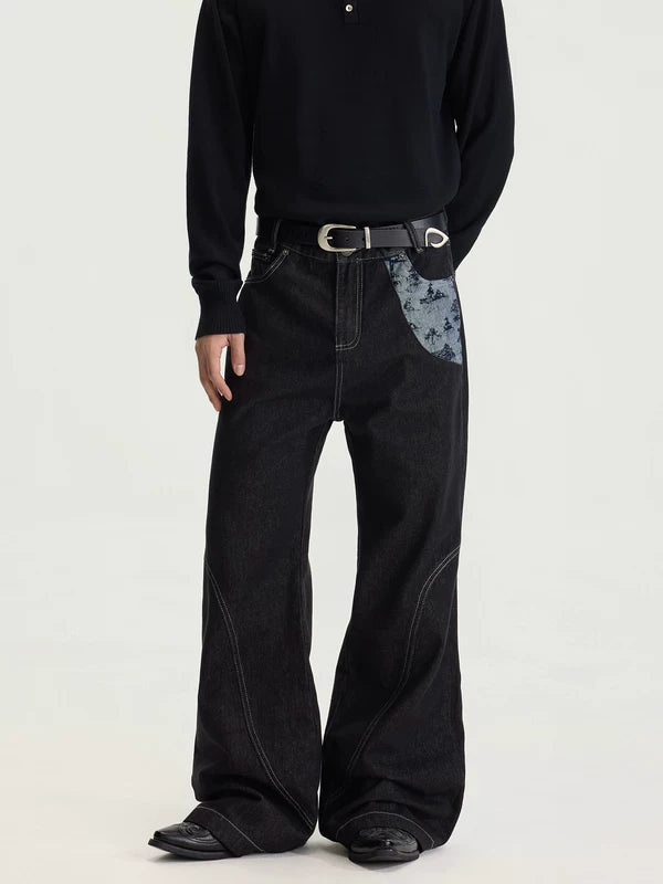 Pantaloni in denim grezzo a gamba larga con toppe 