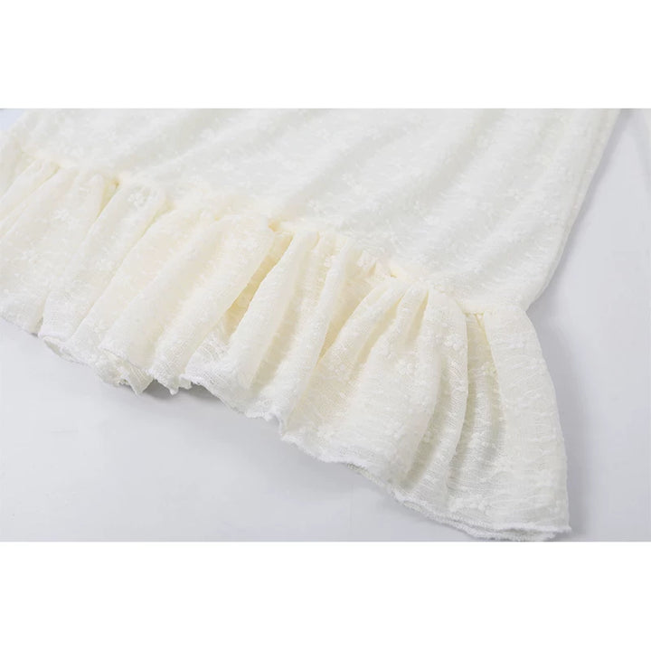 Top de peplum de encaje de manga larga con cuello alto 