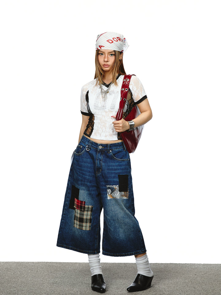 Top corto con scollo a V in pizzo trasparente 