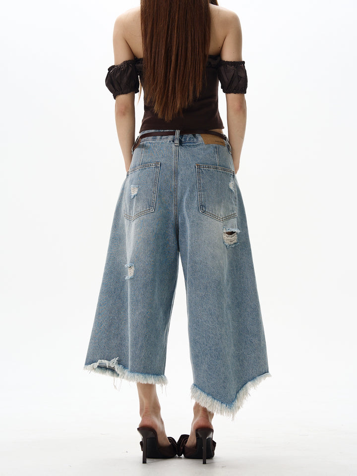 不規則なダメージ加工のワイドレッグデニムパンツ 