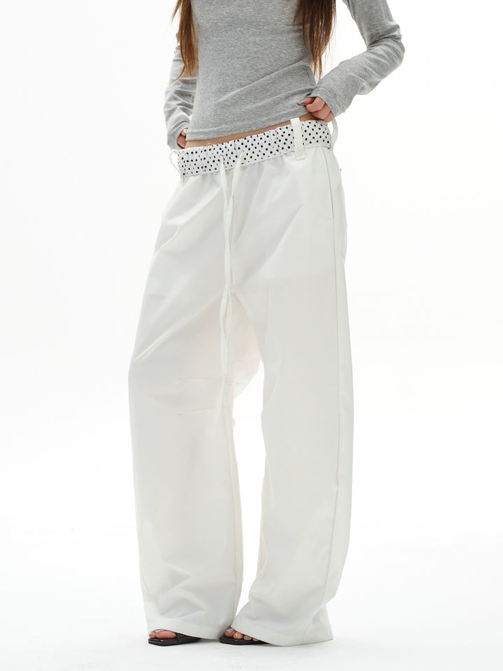 Pantaloni a gamba larga con cintura a pois 