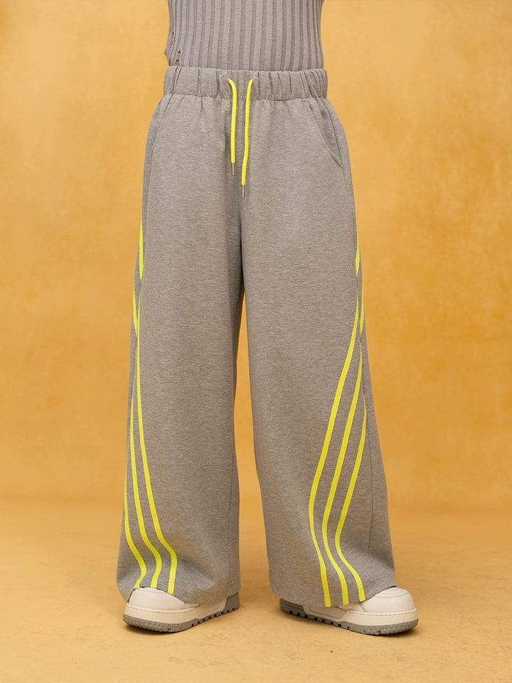 Pantalones deportivos de pierna ancha a rayas con cintura elástica 