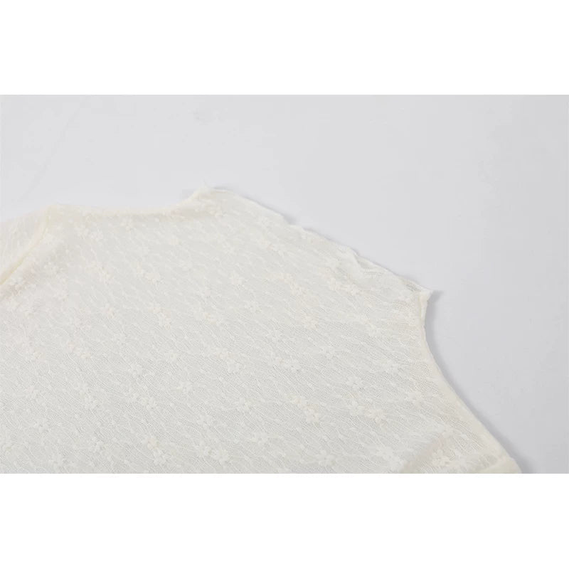 Top de peplum de encaje de manga larga con cuello alto 