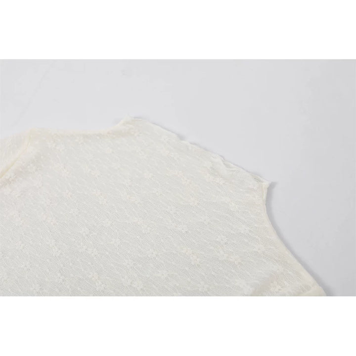 Top de peplum de encaje de manga larga con cuello alto 