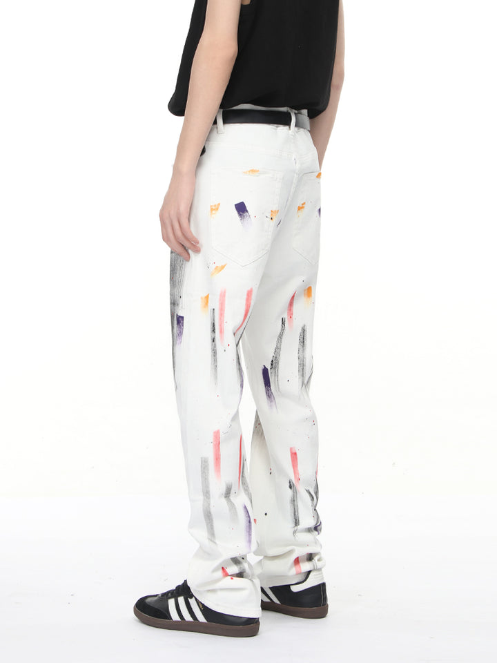 Pantalons droits déchirés en denim graffiti 