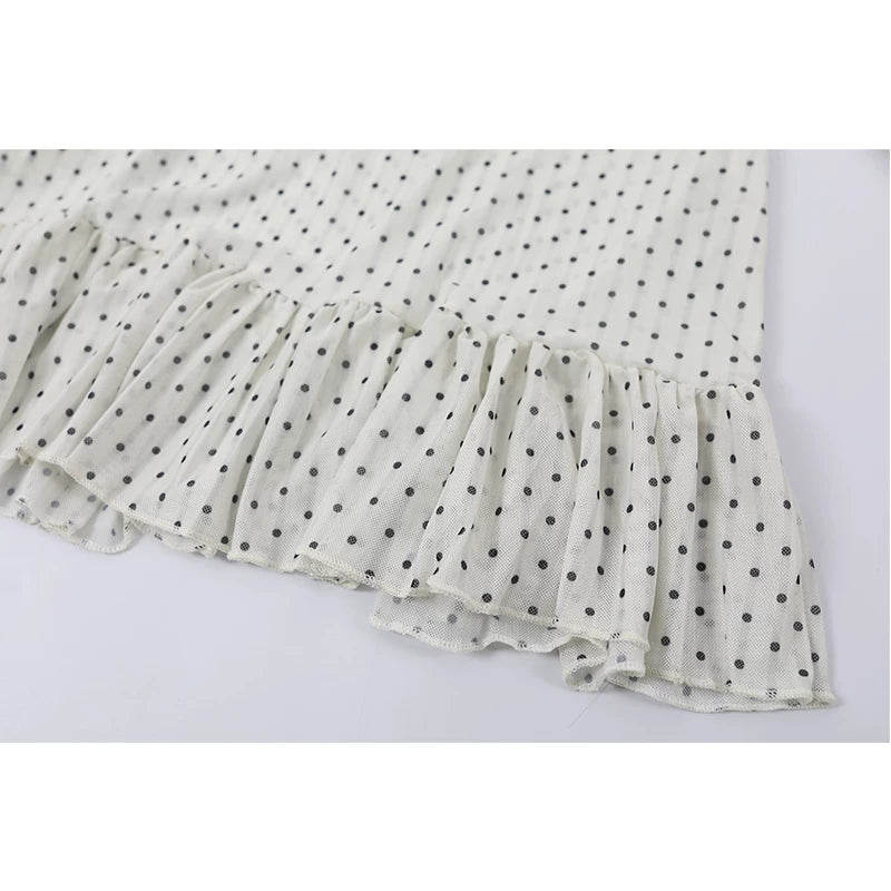 Polka Dot Ruffled Hem Turtleneck Top