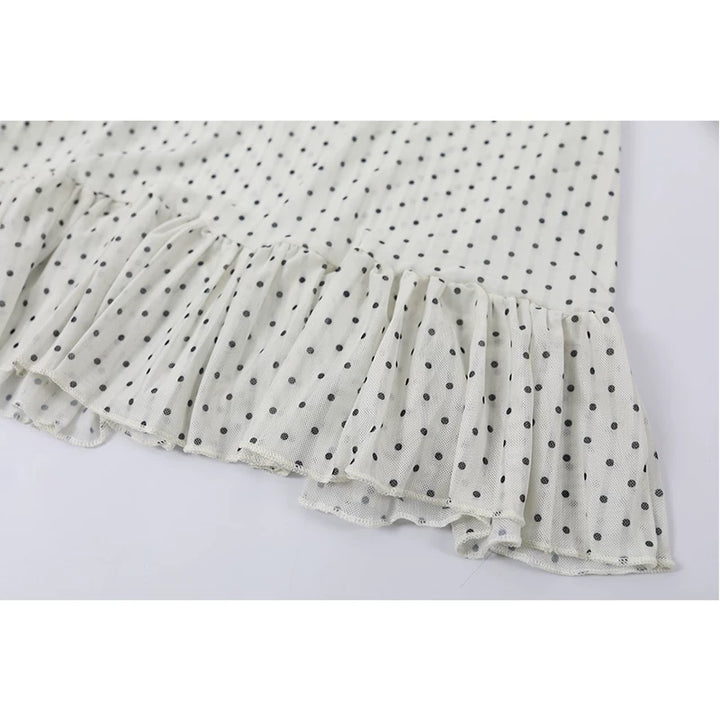 Polka Dot Ruffled Hem Turtleneck Top