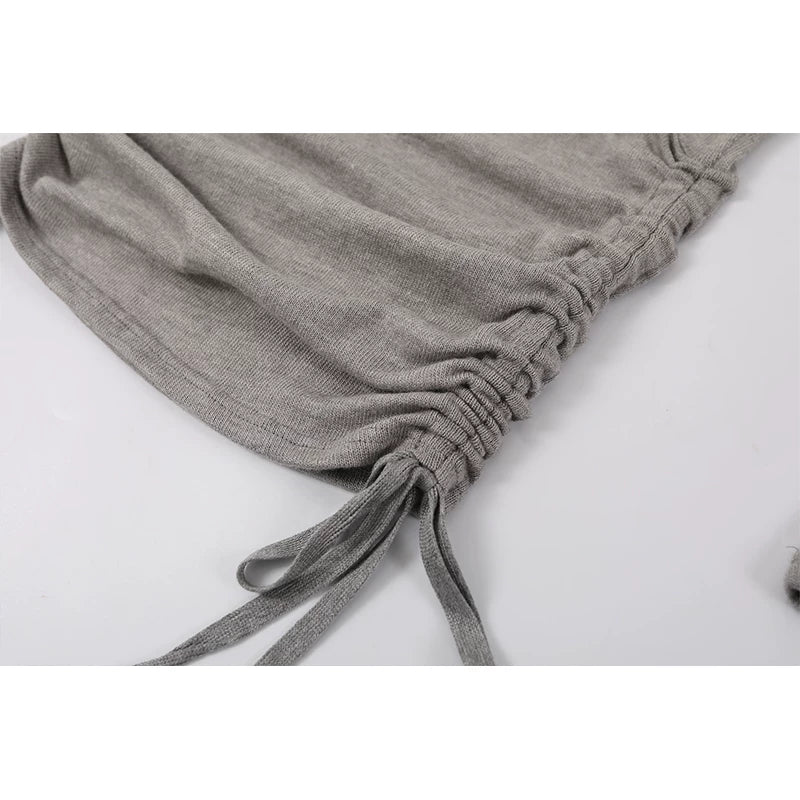 Pull en tricot avec encolure croisée et ourlet froncé 